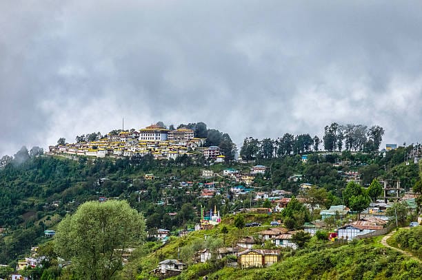 Tawang Monastery in August with fog and green landscape