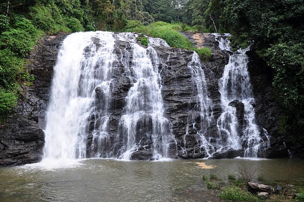 Coorg in August with coffee estates and flowing waterfalls